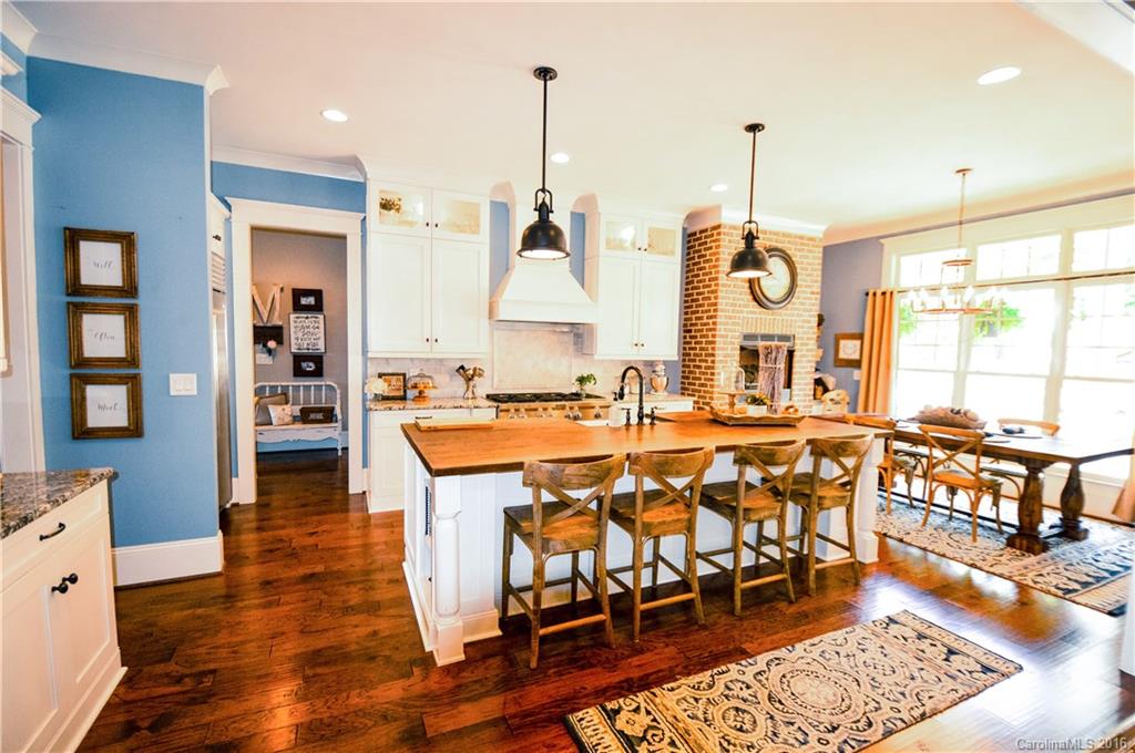 1024 Perriwinkle Lane Fort Mill, SC 29708 - Photo 6 of 24 a large kitchen with lots of counter space and furniture