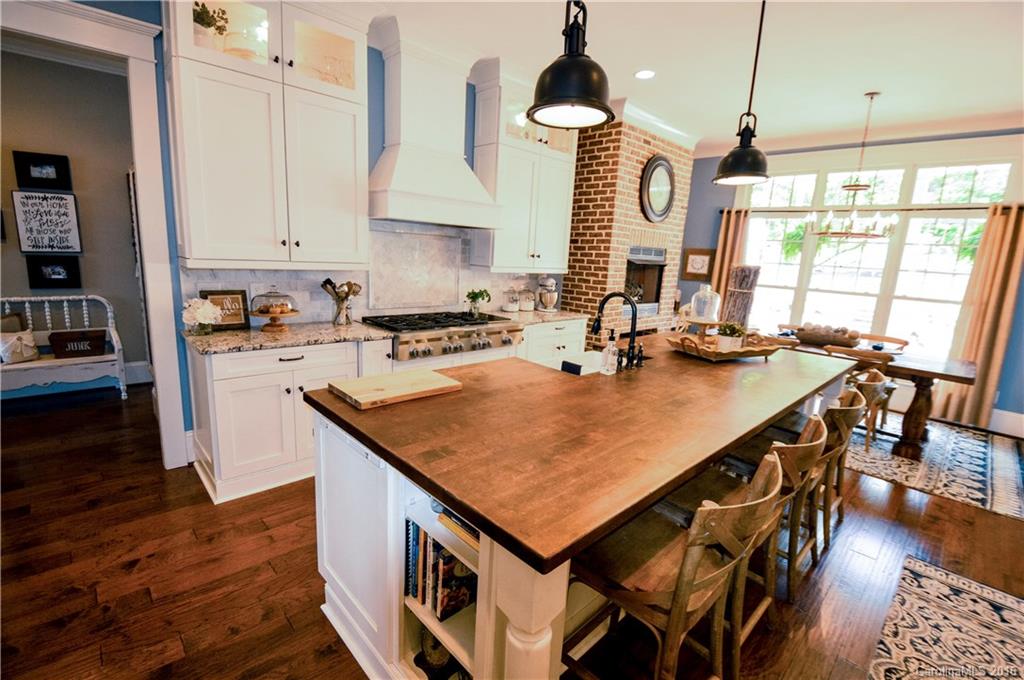 1024 Perriwinkle Lane Fort Mill, SC 29708 - Photo 9 of 24 a kitchen with a stove a sink and a refrigerator