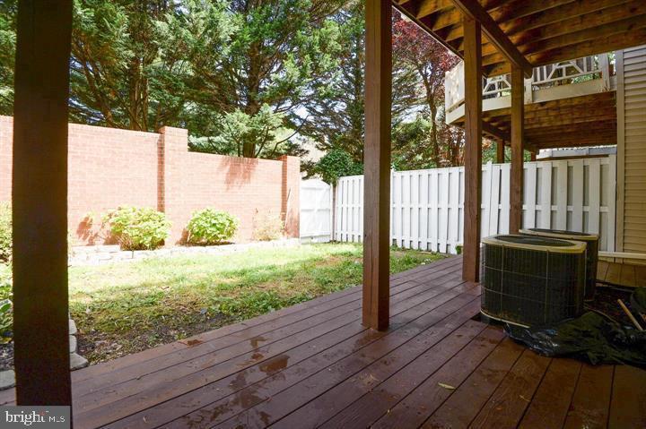 9404 Regency Crest Drive Vienna, VA 22181 - Photo 20 of 25 a view of backyard with wooden floor and outdoor seating