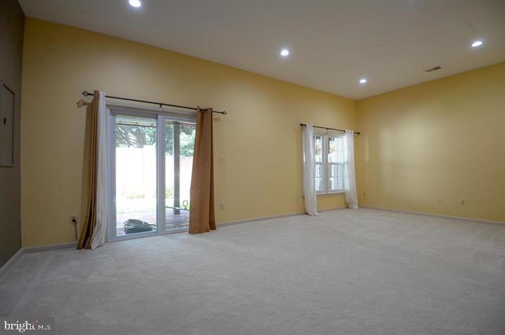 9404 Regency Crest Drive Vienna, VA 22181 - Photo 22 of 25 a view of an empty room with windows