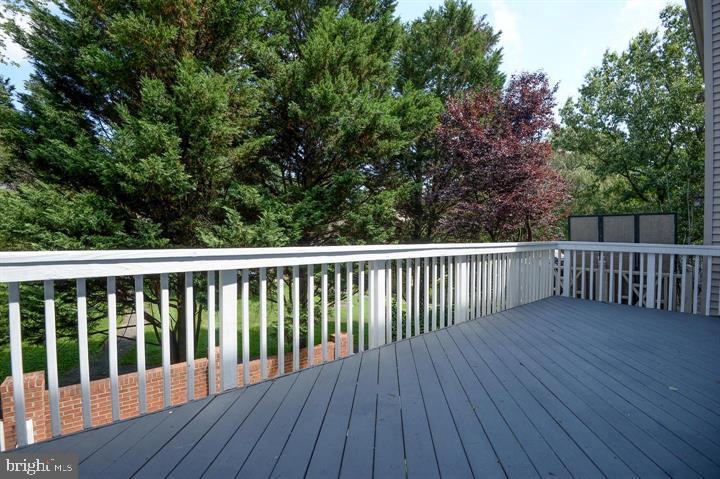 9404 Regency Crest Drive Vienna, VA 22181 - Photo 24 of 25 a balcony with wooden floor and fence