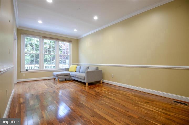 9404 Regency Crest Drive Vienna, VA 22181 - Photo 5 of 25 a living room with furniture and a large window