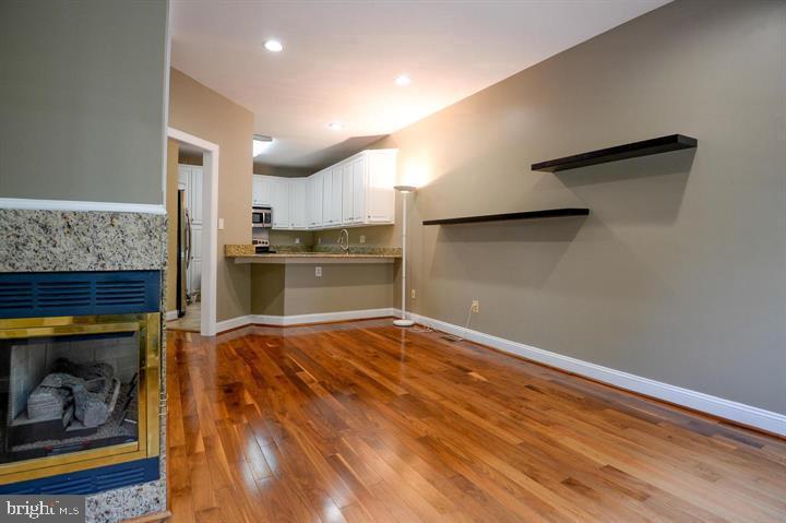 9404 Regency Crest Drive Vienna, VA 22181 - Photo 7 of 25 a kitchen with a refrigerator and a stove
