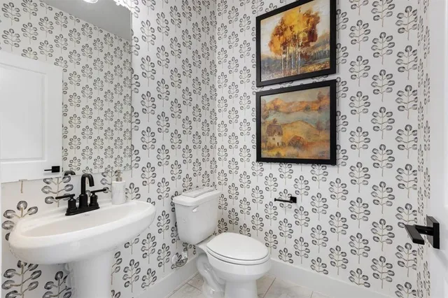 a bathroom with a toilet and a sink