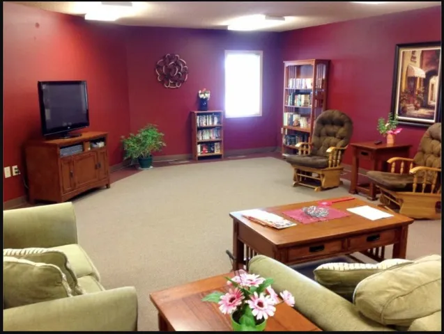 a living room with furniture and a flat screen tv