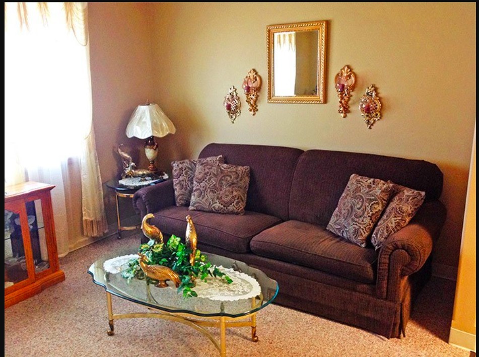 741 Streeter Drive Other, SD 57049 - Photo 5 of 10 a living room with furniture flowerpot and wooden floor