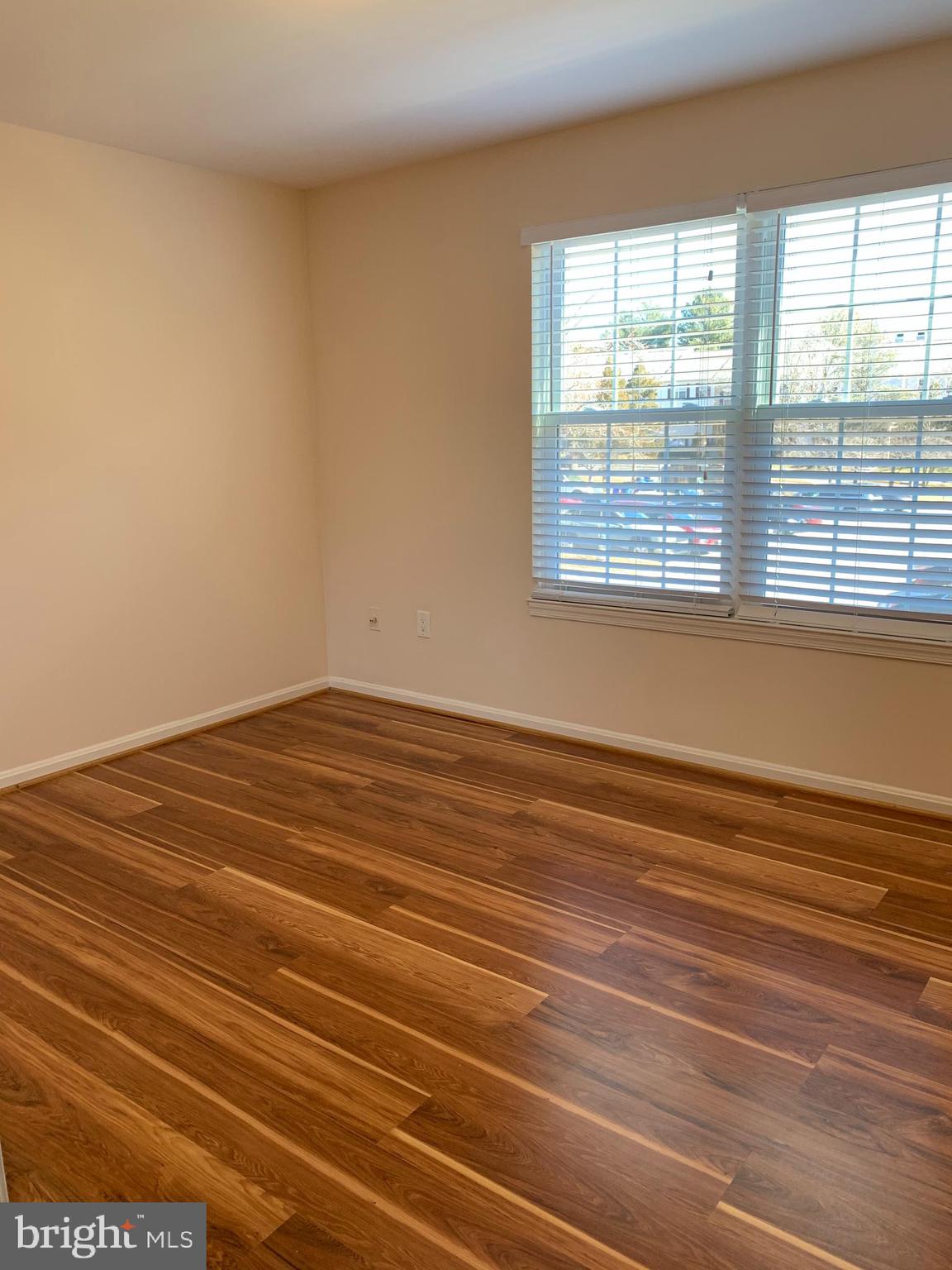 2 Normandy Square Court, Unit D Silver Spring, MD 20906 - Photo 12 of 23 a view of empty room with wooden floor and fan