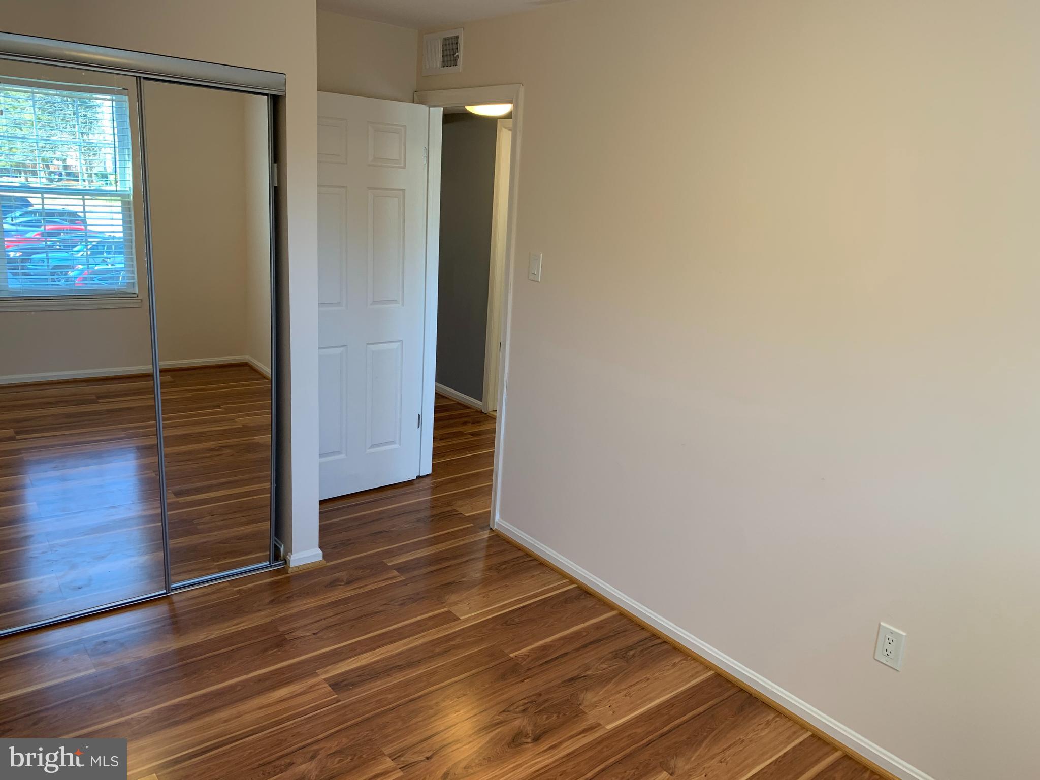 2 Normandy Square Court, Unit D Silver Spring, MD 20906 - Photo 14 of 23 a view of a hallway with wooden floor