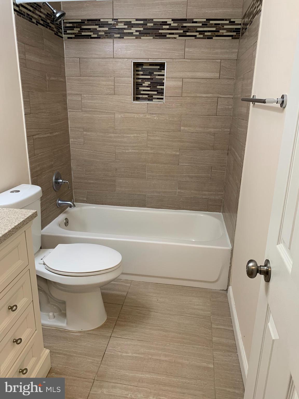 2 Normandy Square Court, Unit D Silver Spring, MD 20906 - Photo 16 of 23 a bathroom with a toilet and a shower