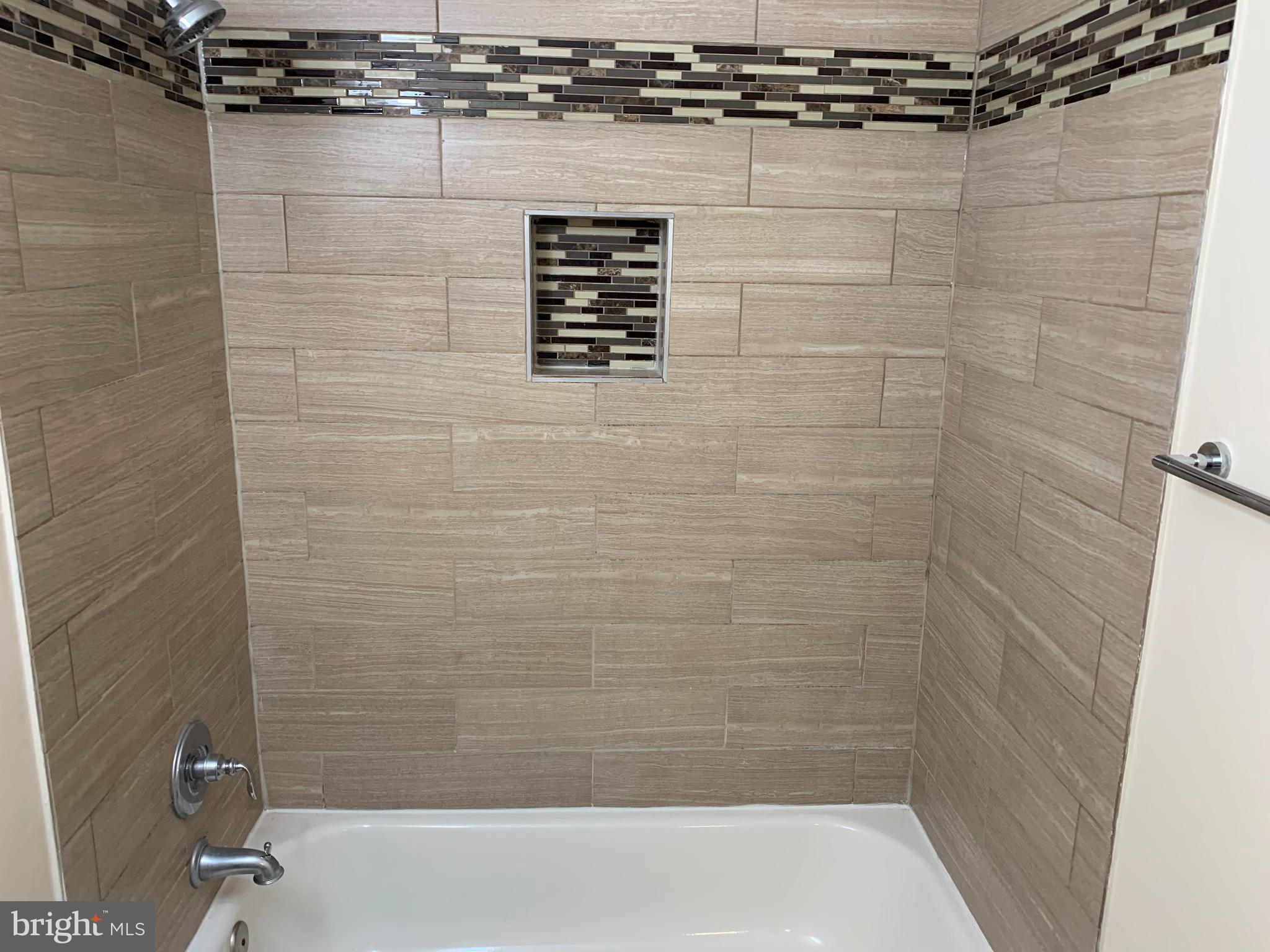 2 Normandy Square Court, Unit D Silver Spring, MD 20906 - Photo 18 of 23 a bathroom with a shower