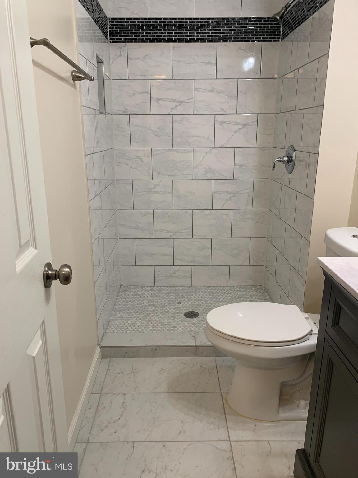 2 Normandy Square Court, Unit D Silver Spring, MD 20906 - Photo 19 of 23 a bathroom with a toilet and a shower