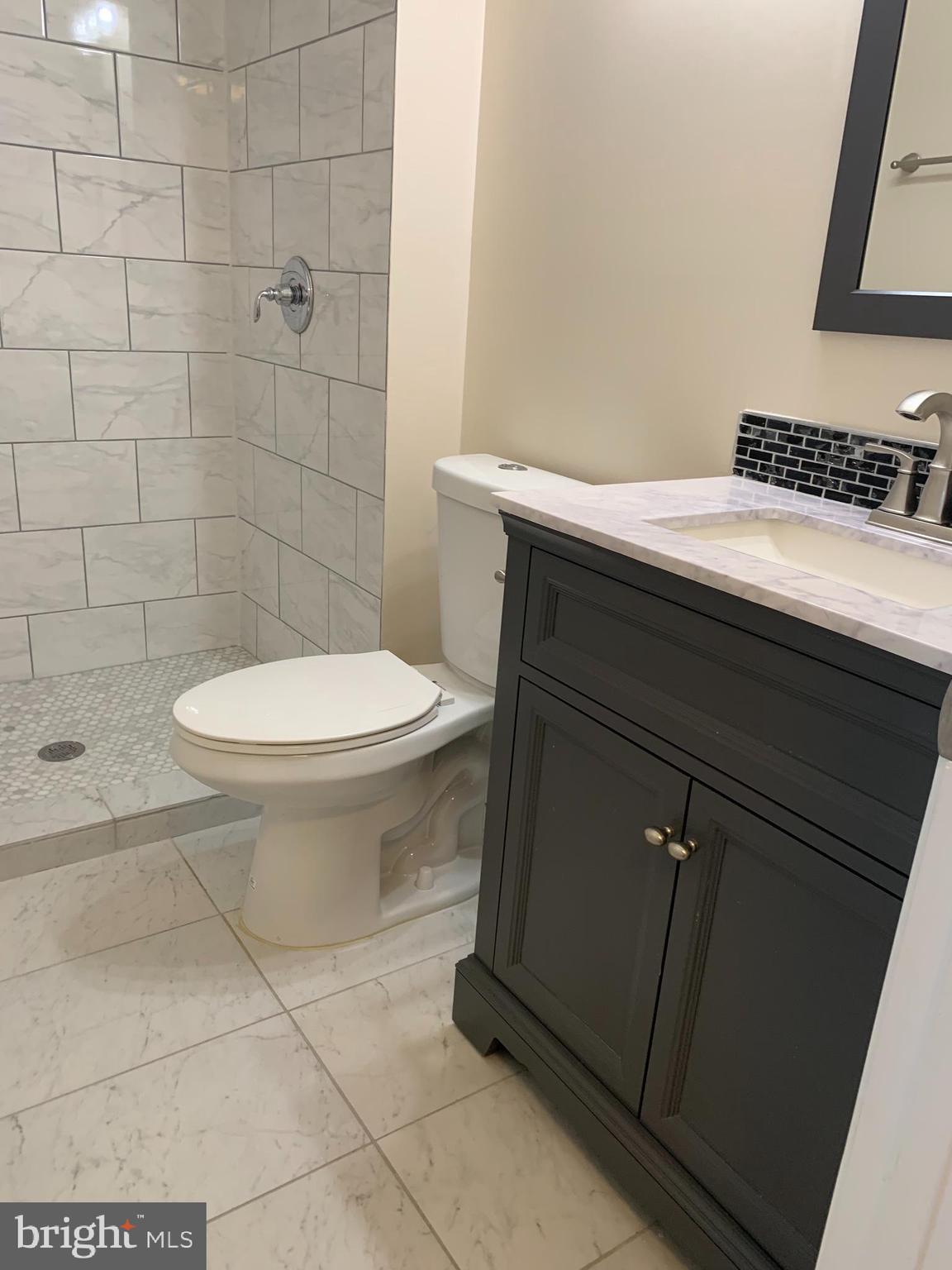 2 Normandy Square Court, Unit D Silver Spring, MD 20906 - Photo 20 of 23 a bathroom with a sink and a toilet