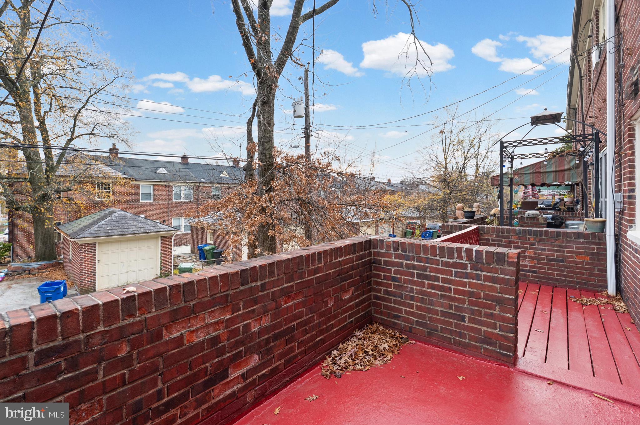 1539 Ralworth Road Baltimore, MD 21218 - Photo 16 of 44 Brick patio with a raised deck extension