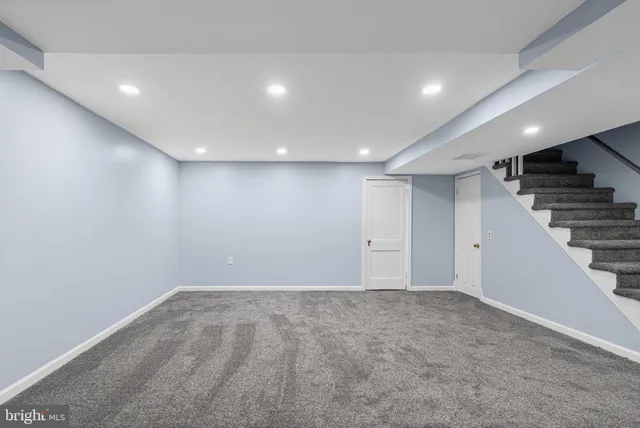 a view of an empty room with stairs