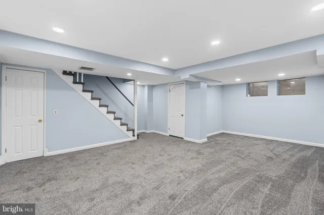 an empty room with closet and bathroom