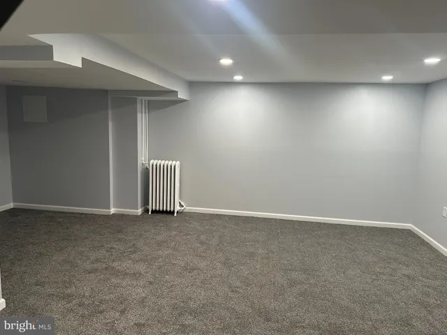 a front view of a building with a road