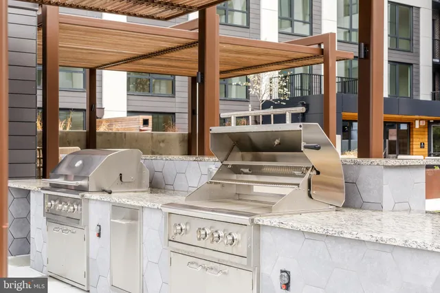a view of a living room and kitchen with a large window