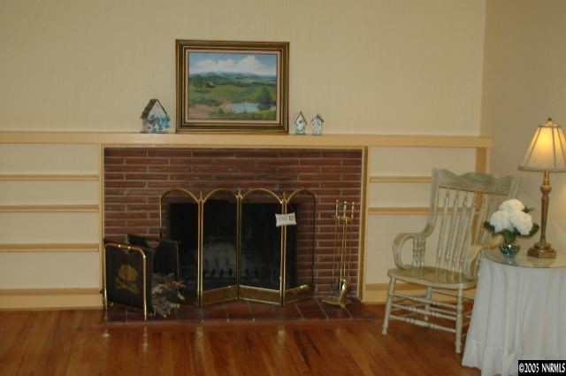 1281 University Terrace Reno, NV 89503 - Photo 2 of 5 a view of a fireplace with a table and chairs