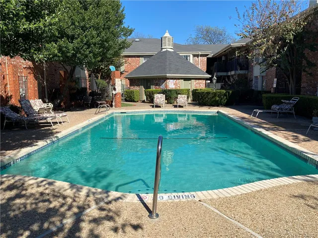 a view of a house with a swimming pool