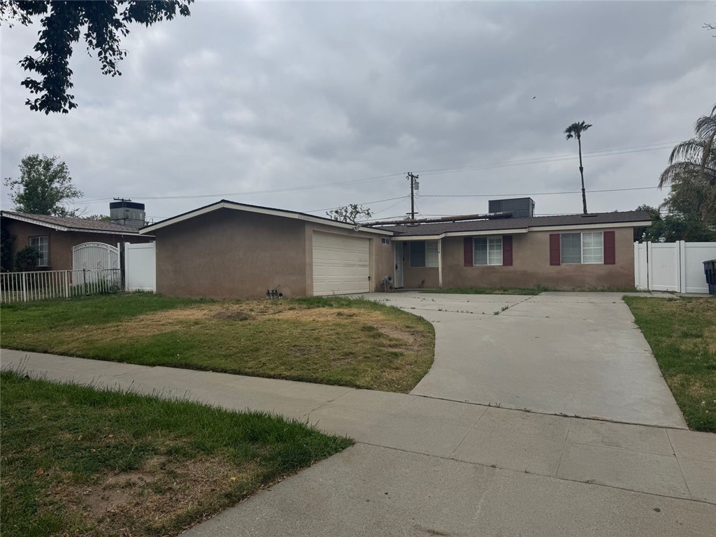 3338 Vance Street Riverside, CA 92504 - Photo 1 of 11 a front view of a house with a garden