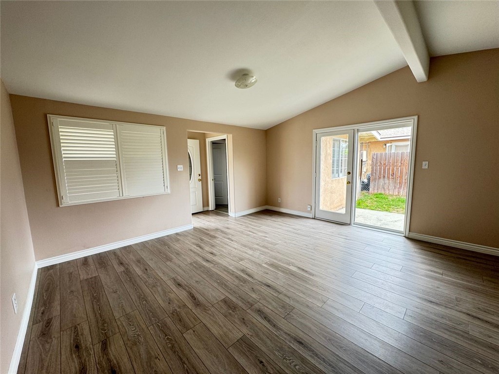 3338 Vance Street Riverside, CA 92504 - Photo 3 of 11 a view of empty room with wooden floor and fan