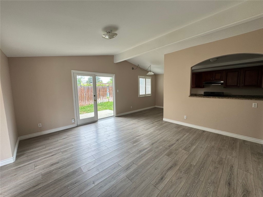 3338 Vance Street Riverside, CA 92504 - Photo 10 of 11 a view of a livingroom with wooden floor and a fireplace