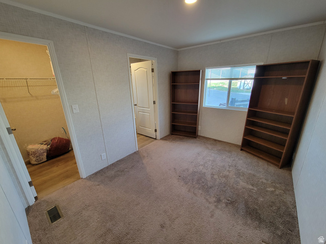156 Cushing Way Layton, UT 84041 - Photo 9 of 20 Carpeted room with a window, recessed ceiling lighting, and two interior doorways