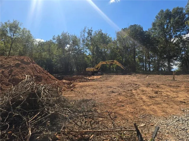 a view of outdoor space with trees all around