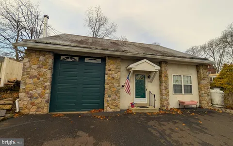 a front view of a house with a garage
