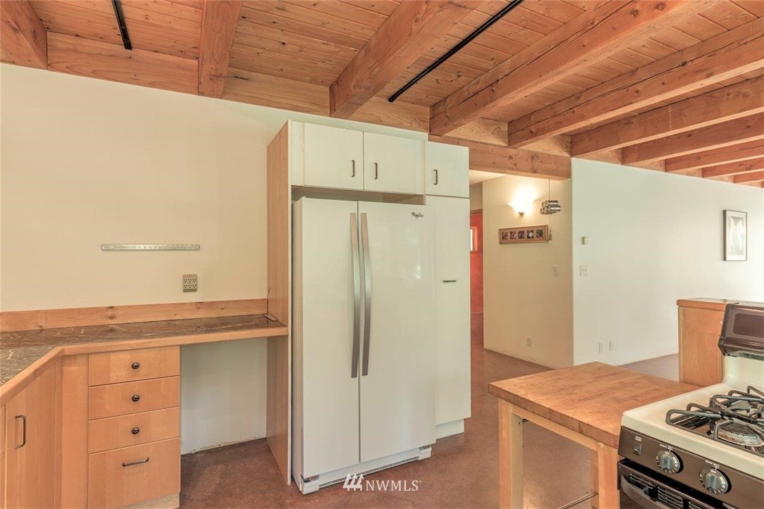 105 Naylor Creek Road Chimacum, WA 98325 - Photo 11 of 24 a kitchen with white cabinets and white appliances