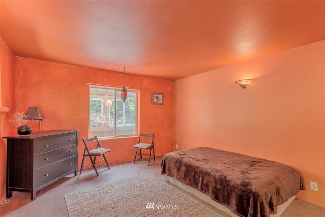105 Naylor Creek Road Chimacum, WA 98325 - Photo 12 of 24 a bedroom with a bed and a window