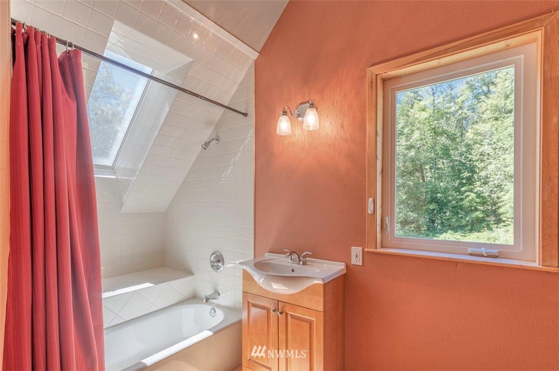 105 Naylor Creek Road Chimacum, WA 98325 - Photo 19 of 24 a bathroom with a granite countertop sink toilet and shower