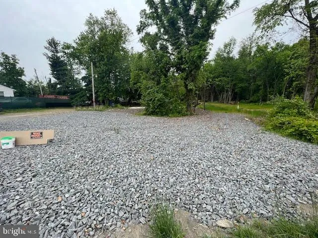 a view of a tiny house with a yard