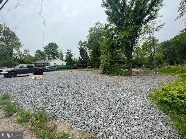 a view of outdoor space with deck and yard