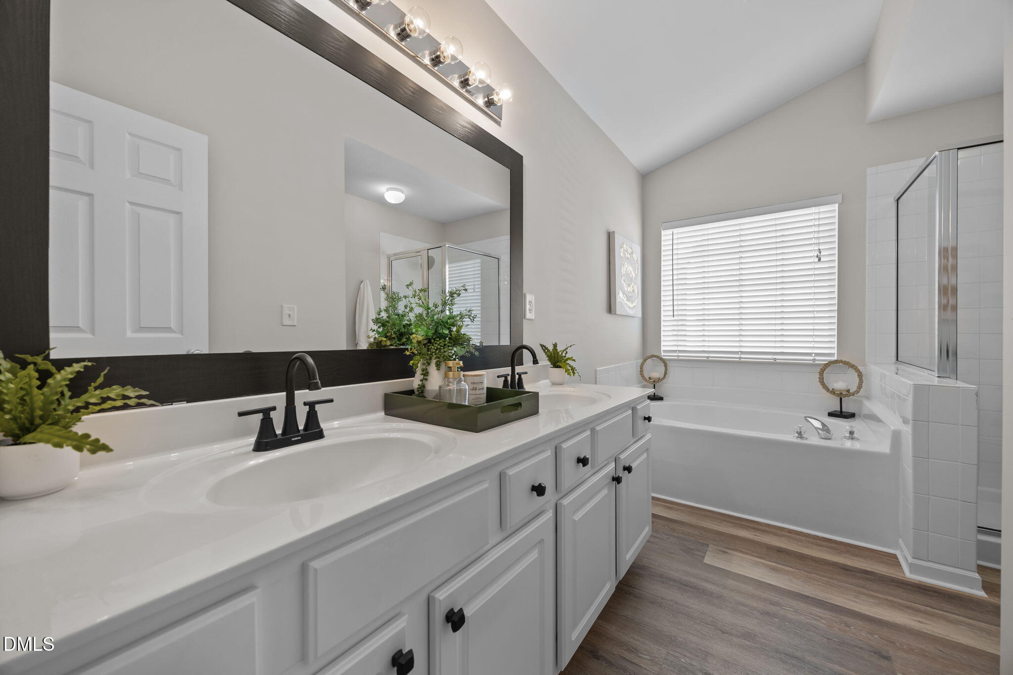 1003 Red Hat Lane Durham, NC 27713 - Photo 42 of 60 a bathroom with a tub a sink and mirror