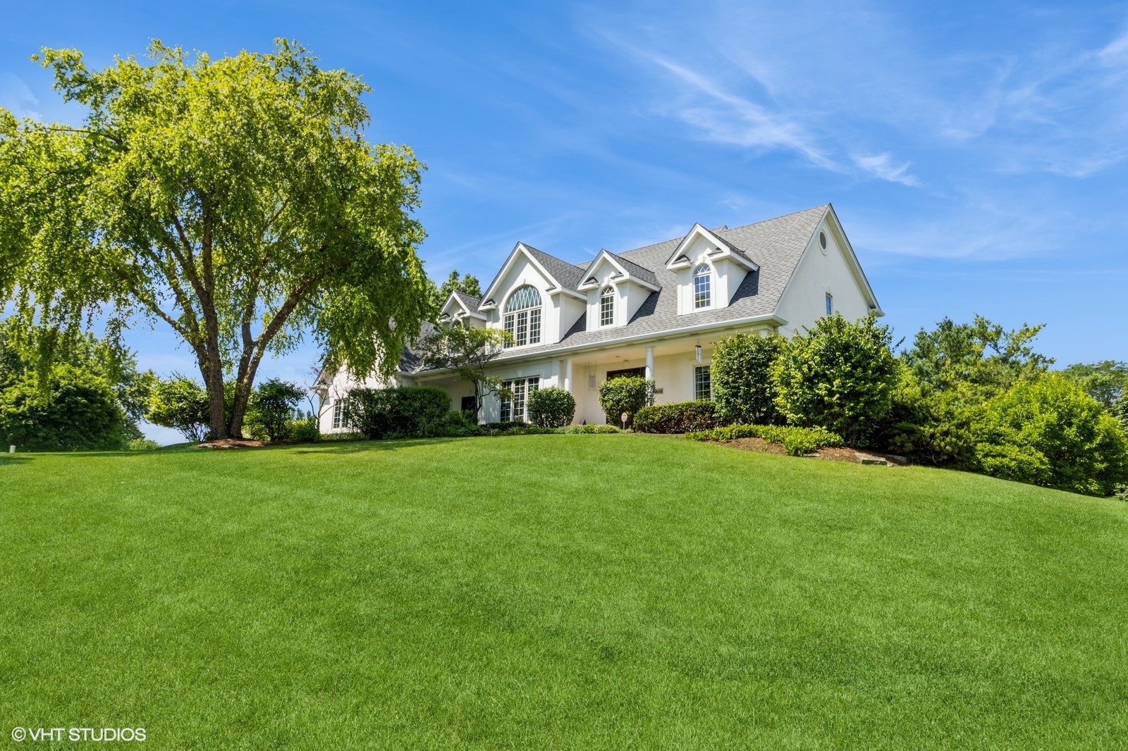 a front view of a house with garden