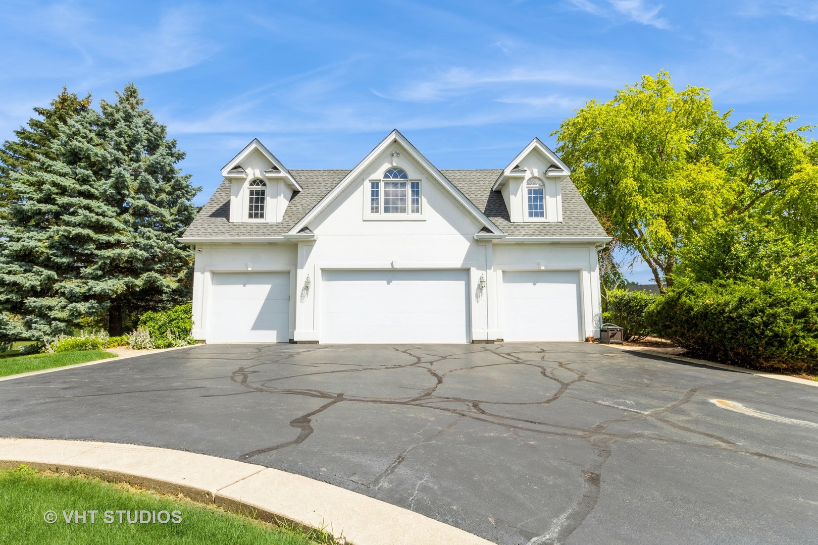 18N250 Sawyer Road Dundee, IL 60102 - Photo 9 of 12 a front view of a house with a yard and garage
