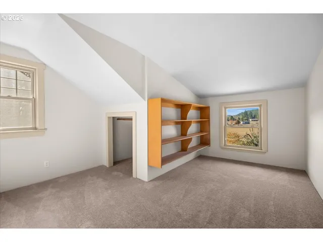 a view of room with window and cabinet