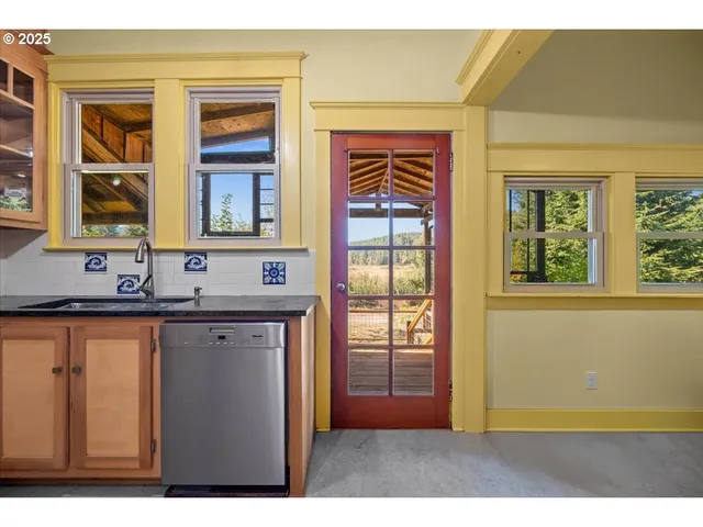 a kitchen that has a sink and a window