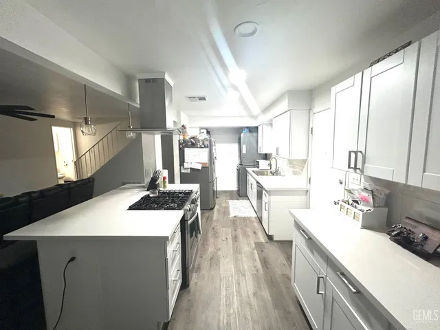 a room with sink washer and dryer