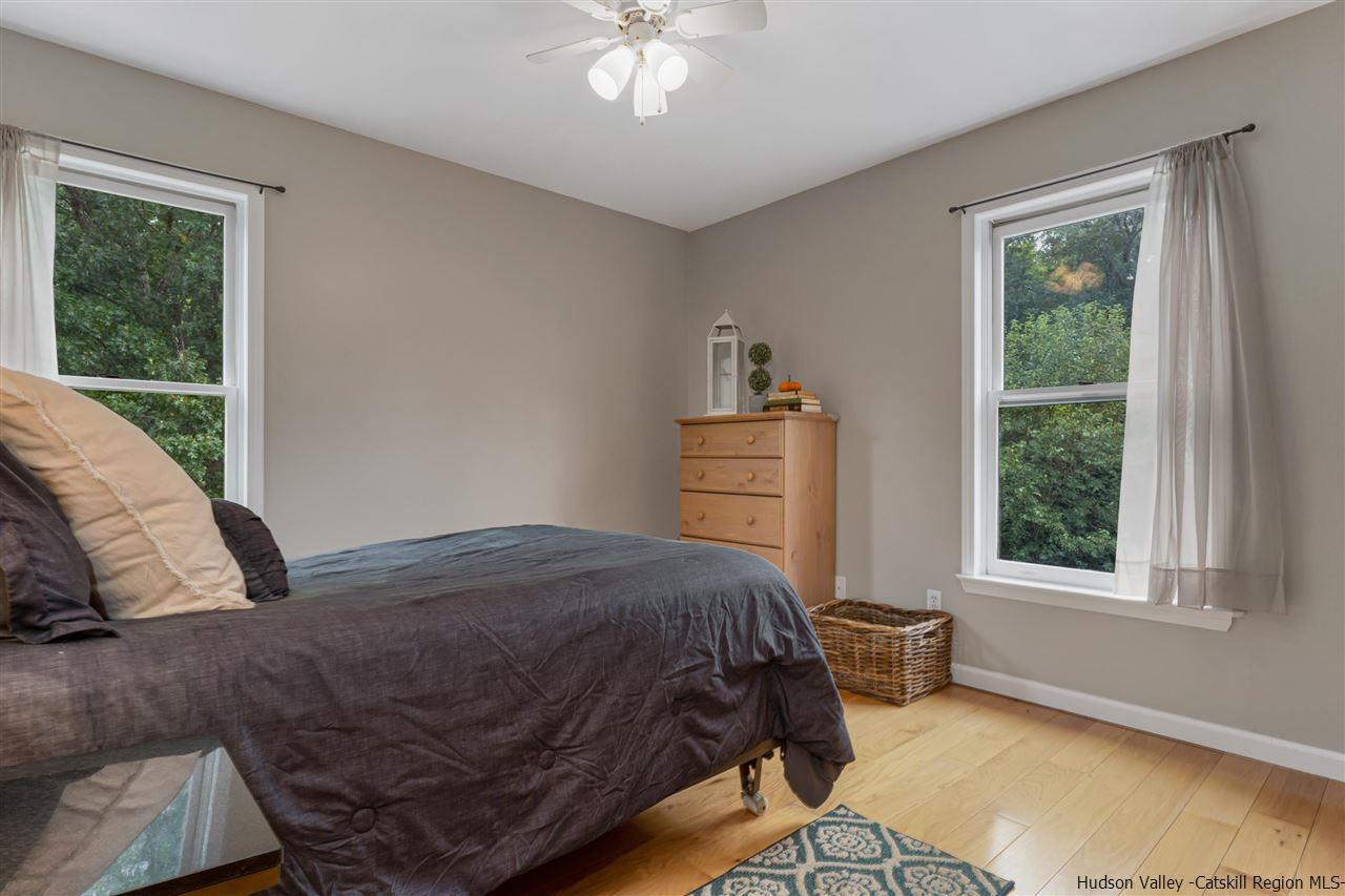 58 Old Powdermill Road Saugerties, NY 12477 - Photo 14 of 35 a bedroom with a bed and window