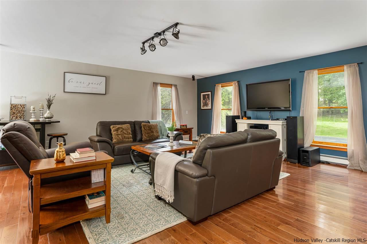58 Old Powdermill Road Saugerties, NY 12477 - Photo 8 of 35 a living room with furniture and a flat screen tv