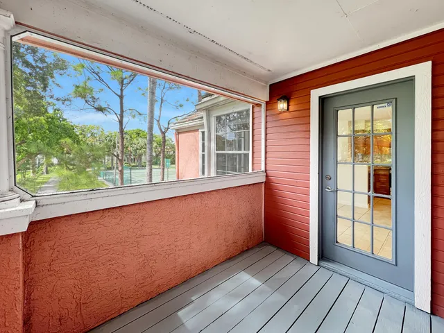 wooden floor in a room next to a window