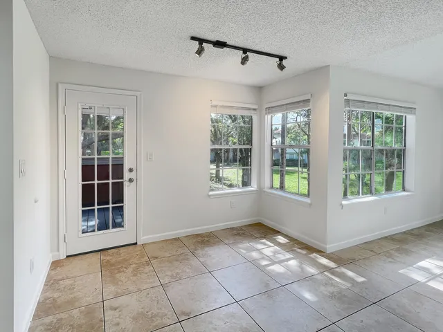 a view of empty room with windows