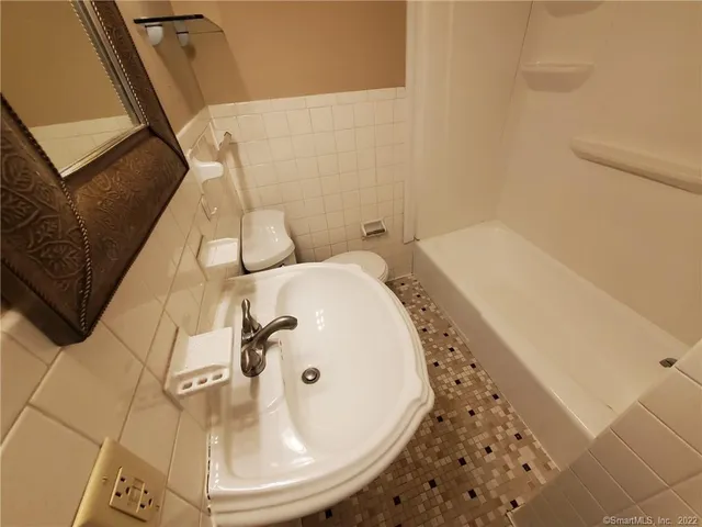 a bathroom with a sink and mirror