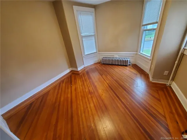 a view of front door with wooden floor