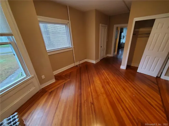 a view of outdoor space with wooden floor and stairs