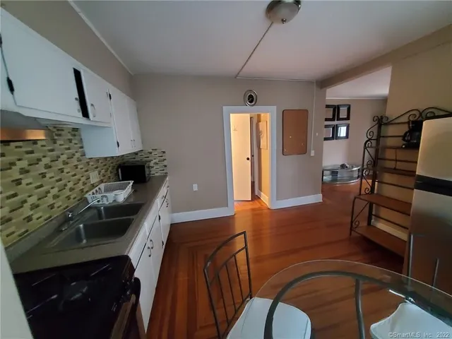 a kitchen with stainless steel appliances granite countertop a stove and a refrigerator