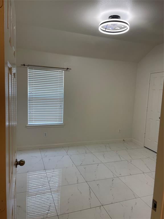 1004 Concan Drive Forney, TX 75126 - Photo 11 of 24 an empty room with chandelier
