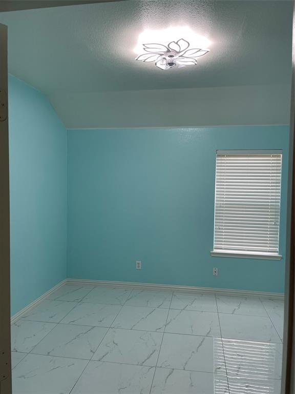 1004 Concan Drive Forney, TX 75126 - Photo 12 of 24 a view of an empty room with a window